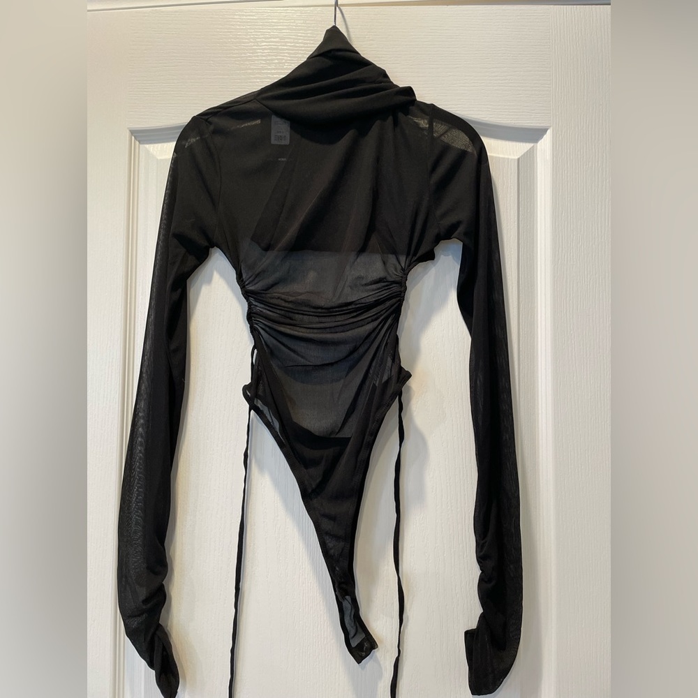 Black mesh high neck bodysuit with extended arms and backless. New. Small